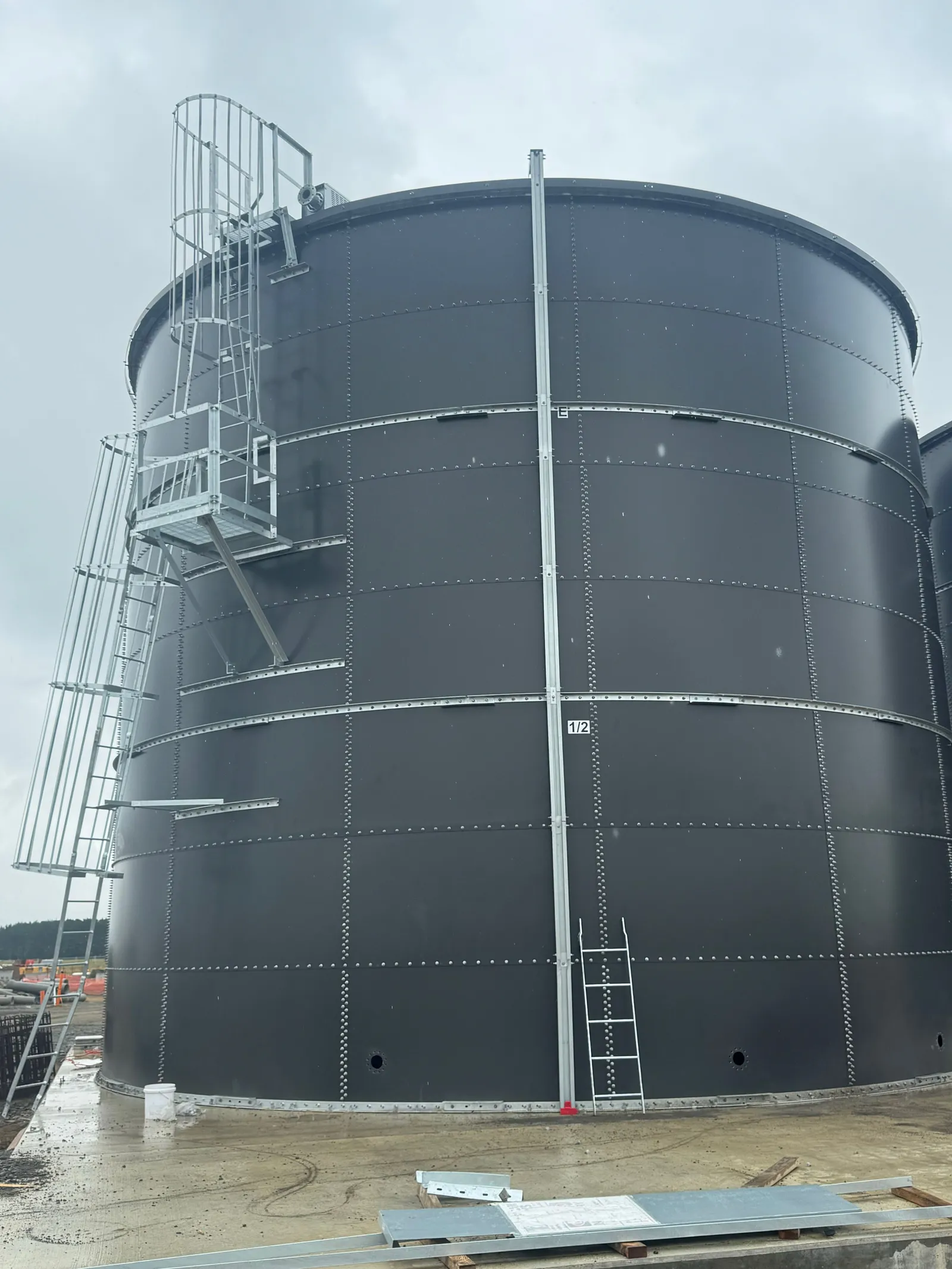 One of the finished tanks from the ground, with its access stair, caged ladder and roof platform